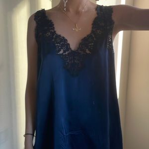 Silk top with lace details.